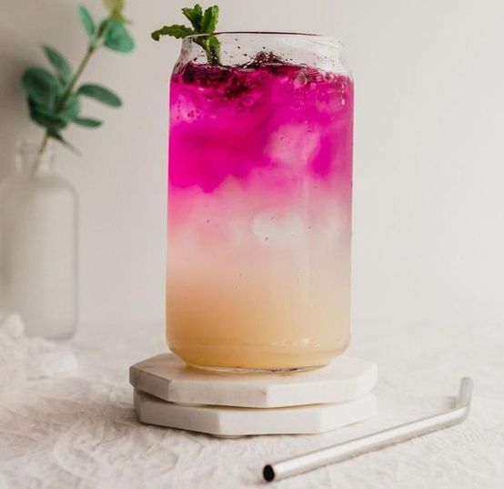 Pink dragon fruit lemonade in a tall glass