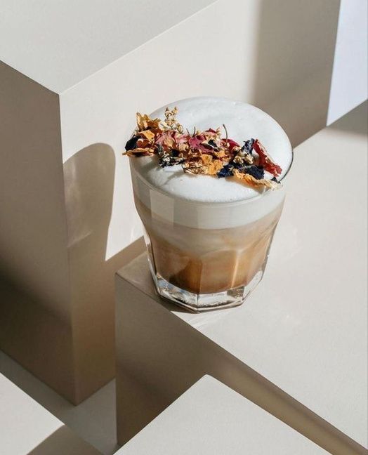Maleki topped with foam and dried rose petals