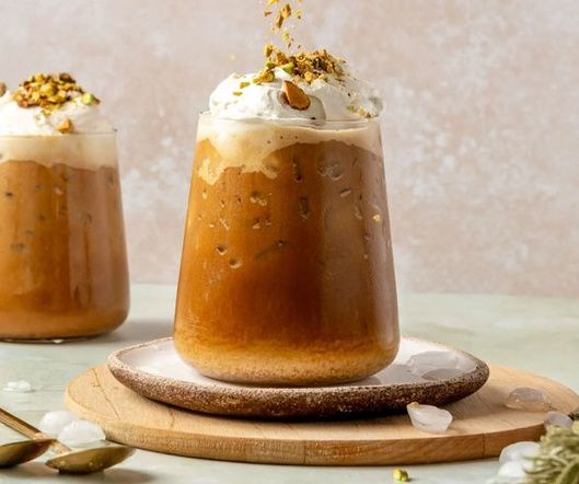 Iced Mufawar topped with cream and crushed pistachio